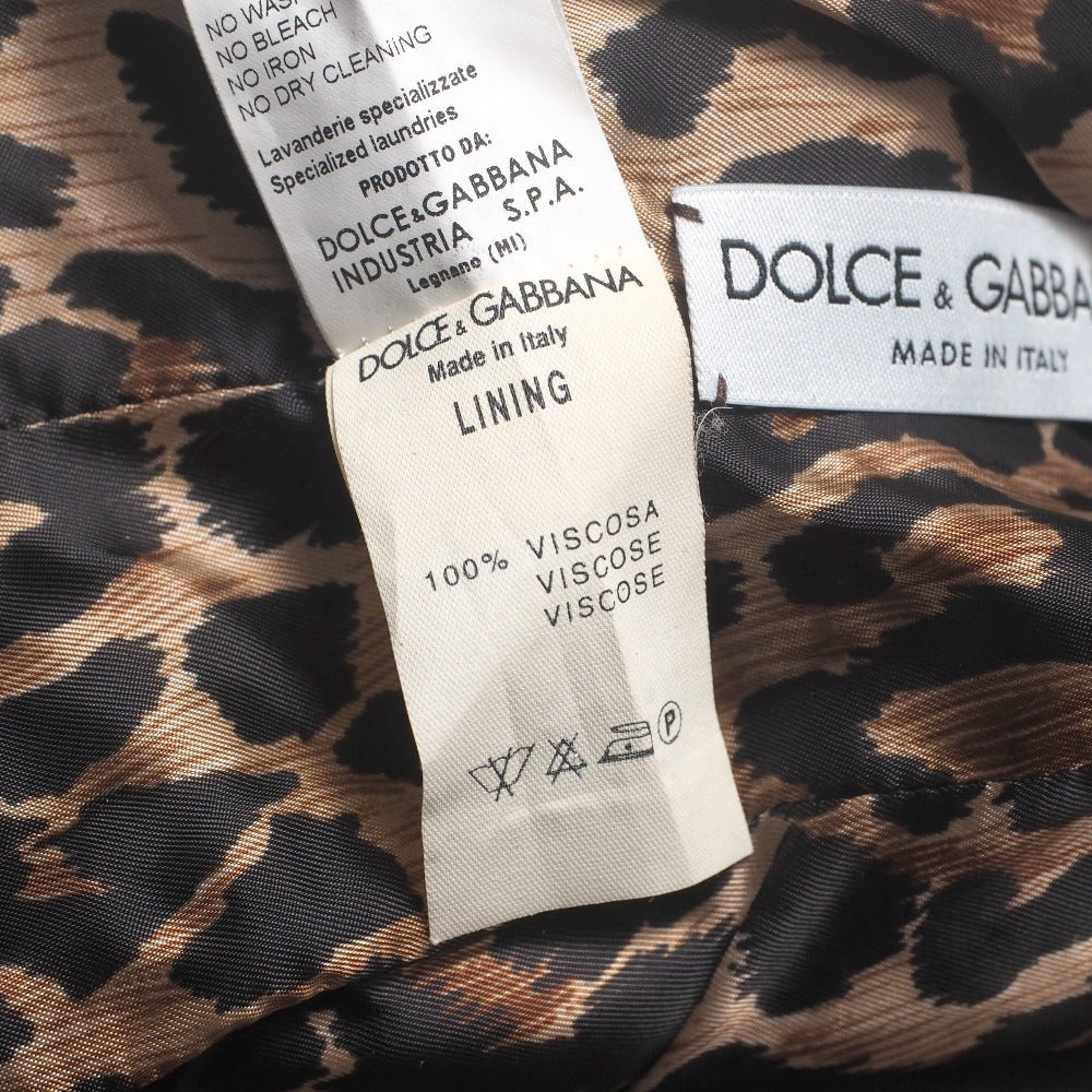 Dolce & Gabbana hooded jacket of brown leather and polecat fur, with goldtone logo buckle closures Size 38 –