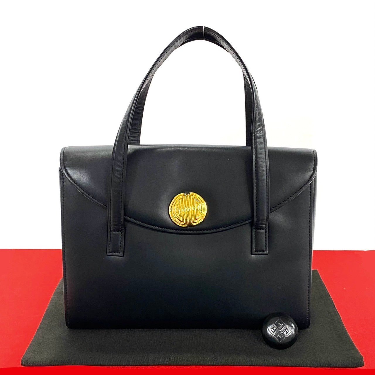 GIVENCHY Vintage Black Leather Handbag with Gold Medallion Logo (Circa 1980s–1990s, Designer: Hubert de Givenchy) – Pre - Owned, 100% Authentic - LLUXE.CA