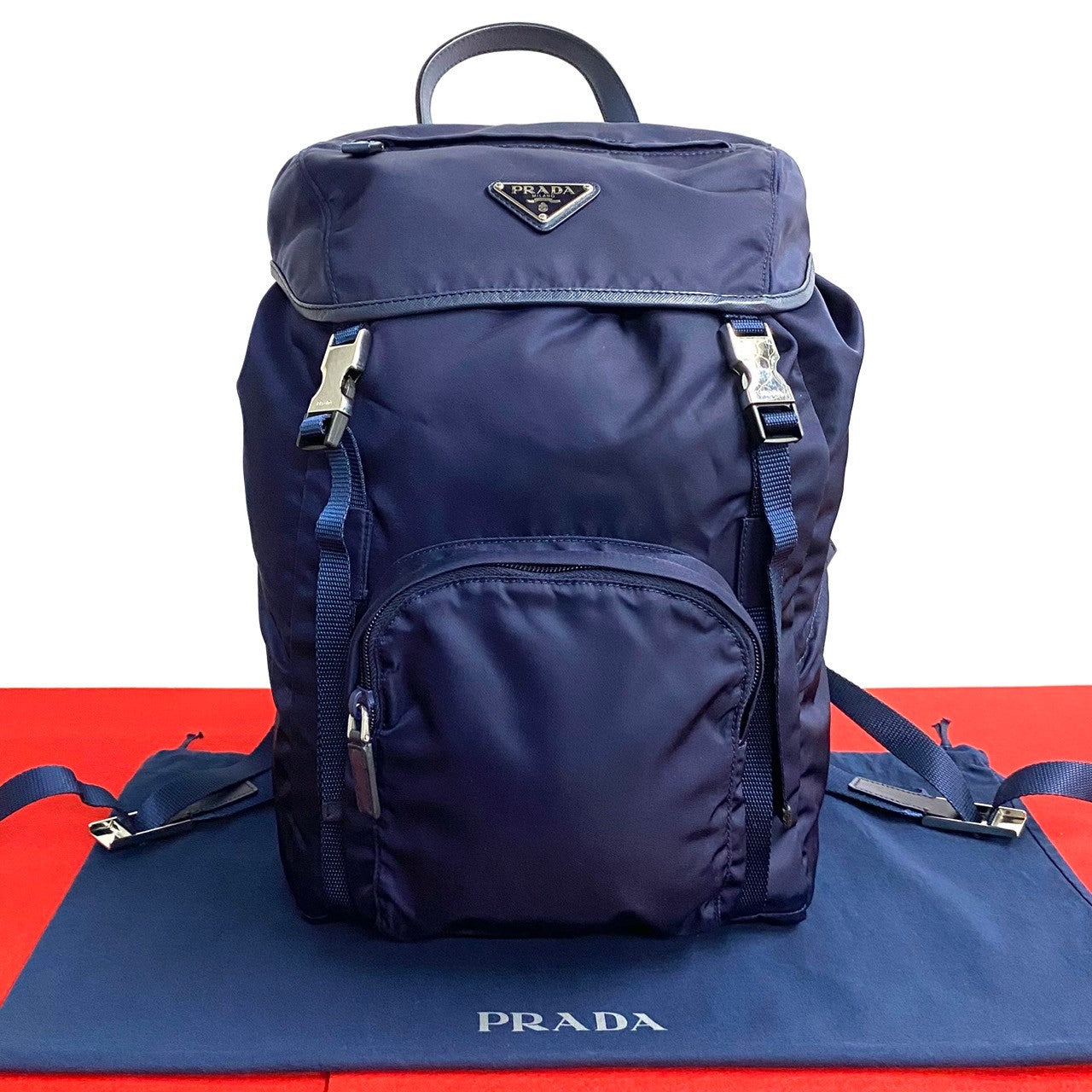 PRADA Triangle Logo Metal –– Navy – 100% Authentic Pre-Owned