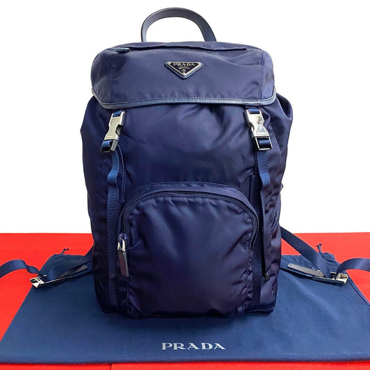 PRADA Triangle Logo Metal –– Navy – 100% Authentic Pre-Owned
