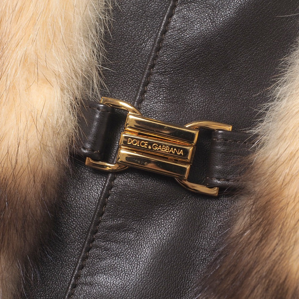 Dolce & Gabbana hooded jacket of brown leather and polecat fur, with goldtone logo buckle closures Size 38 –
