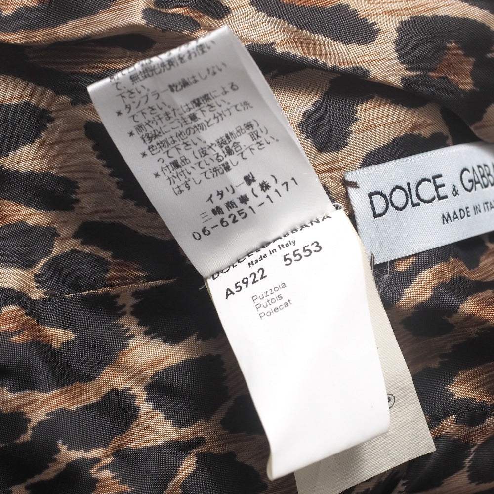 Dolce & Gabbana hooded jacket of brown leather and polecat fur, with goldtone logo buckle closures Size 38 –