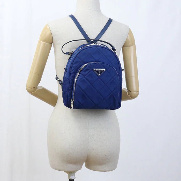 PRADA – – Mini Daypack – Backpack 1BZ066 Designed by Miuccia Prada – 2010s – 100% Authentic Pre - Owned Item No.: usdpr86616011 - LLUXE.CA